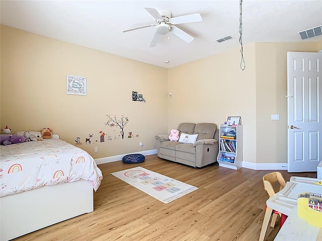 bedroom with visible vents, ceiling fan, light wood-type flooring, and baseboards