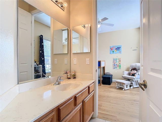 bathroom featuring vanity, wood finished floors, and ceiling fan