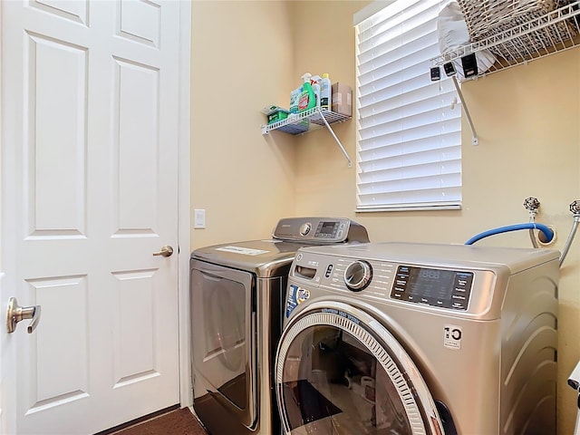 laundry room featuring laundry area and washer and clothes dryer