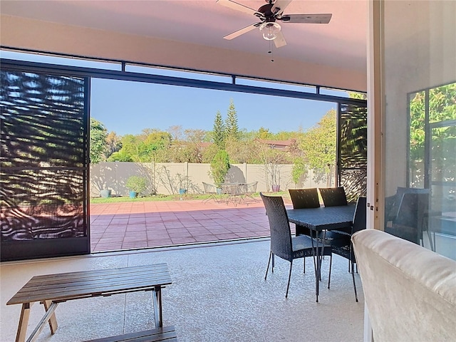 sunroom / solarium with ceiling fan