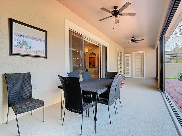 view of patio / terrace featuring outdoor dining area and ceiling fan