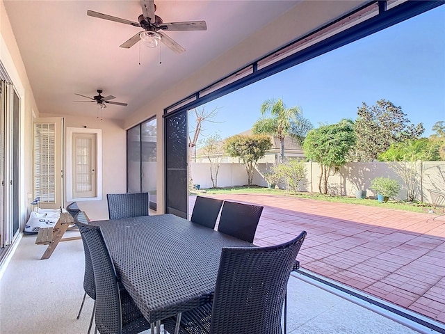 view of patio / terrace with outdoor dining space, a ceiling fan, and a fenced backyard