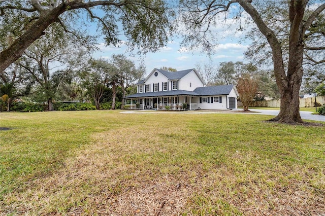 exterior space featuring covered porch and a front yard