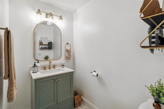 bathroom with baseboards and vanity