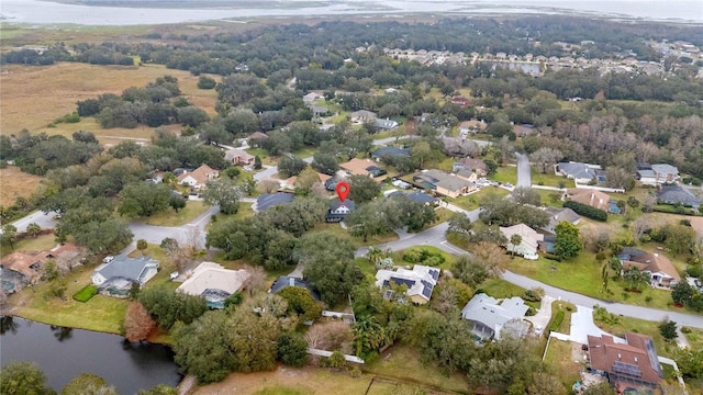 birds eye view of property featuring a residential view and a water view