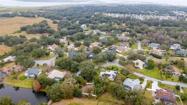 bird's eye view featuring a residential view and a water view