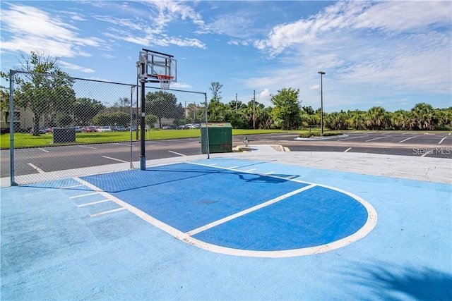 view of sport court with community basketball court and fence