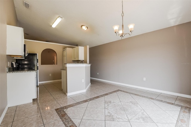 kitchen with visible vents, an inviting chandelier, white cabinets, baseboards, and light stone countertops