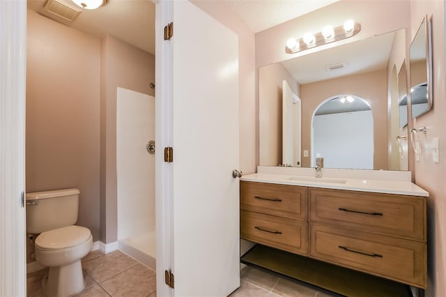 full bath featuring tile patterned floors, visible vents, toilet, and walk in shower