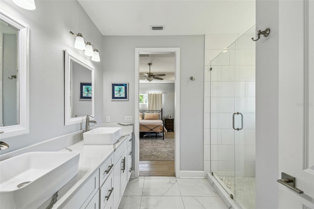 ensuite bathroom featuring ensuite bath, a stall shower, marble finish floor, and a sink