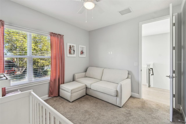 carpeted bedroom featuring visible vents, baseboards, and ceiling fan