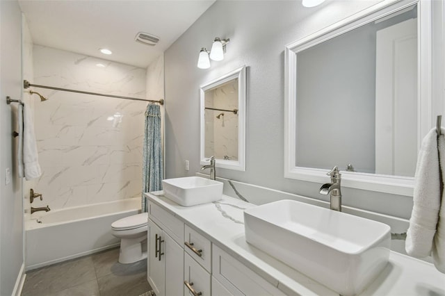 bathroom featuring shower / bath combination with curtain, toilet, double vanity, and a sink