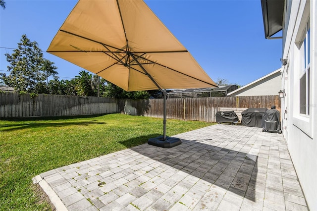 view of patio / terrace with area for grilling and a fenced backyard