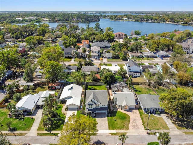 drone / aerial view with a residential view and a water view