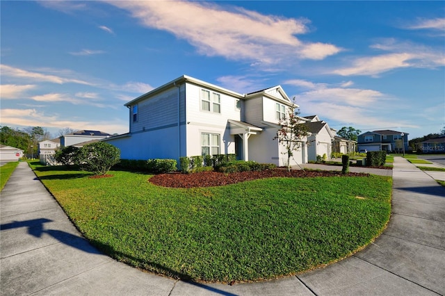 view of home's exterior featuring concrete driveway, a yard, a residential view, and an attached garage