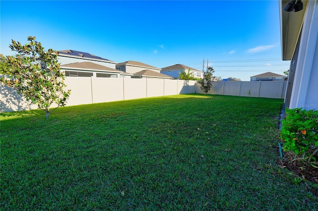 view of yard featuring a fenced backyard