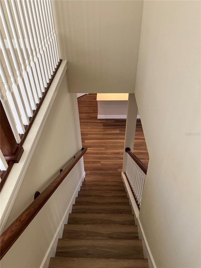 stairs with wood finished floors