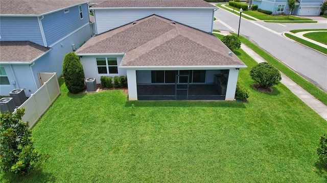 2313 Ivy Harvest Pl, Oviedo, FL 32765 - back of property featuring roof with shingles and a sunroom