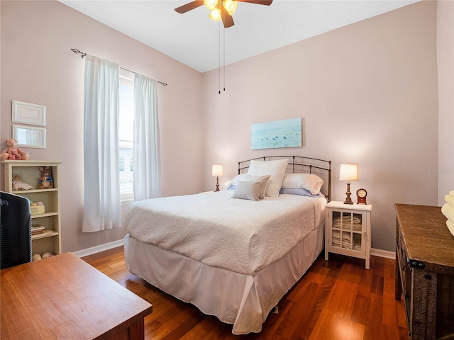 bedroom featuring dark wood finished floors, baseboards, and ceiling fan