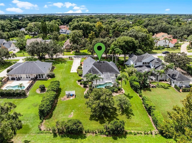 birds eye view of property with a residential view