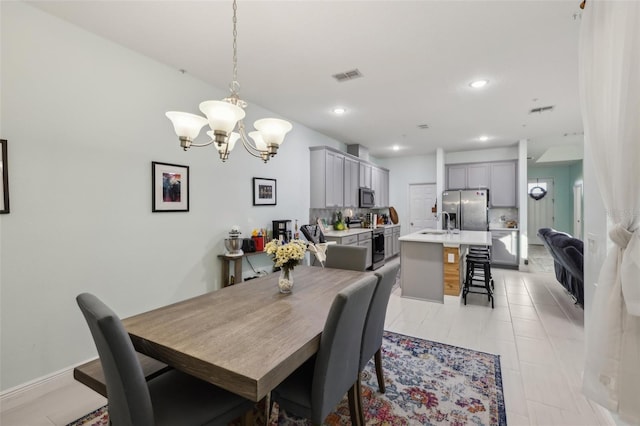 dining area with an inviting chandelier, recessed lighting, and visible vents