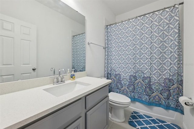 bathroom with vanity, toilet, and shower / bathtub combination with curtain