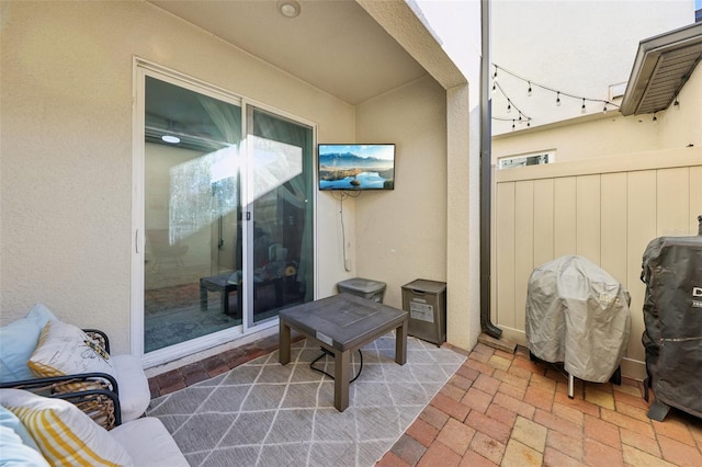 view of patio featuring fence