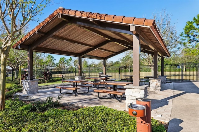 view of home's community featuring a patio and fence