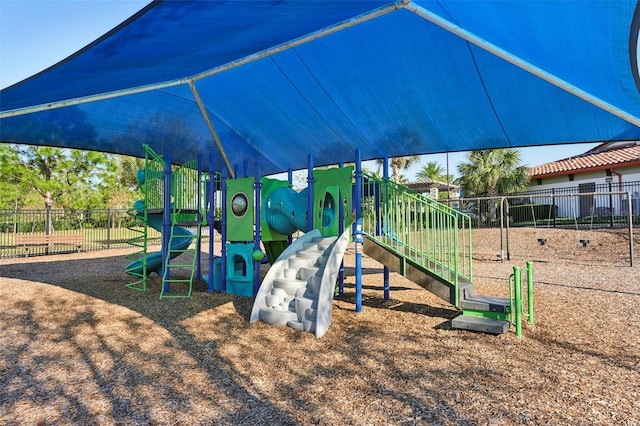 community jungle gym with fence