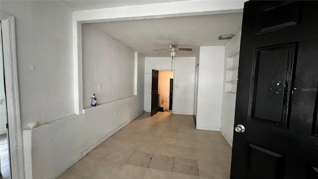 hallway featuring light tile patterned floors