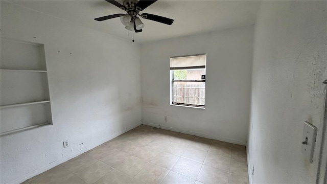 unfurnished room featuring ceiling fan