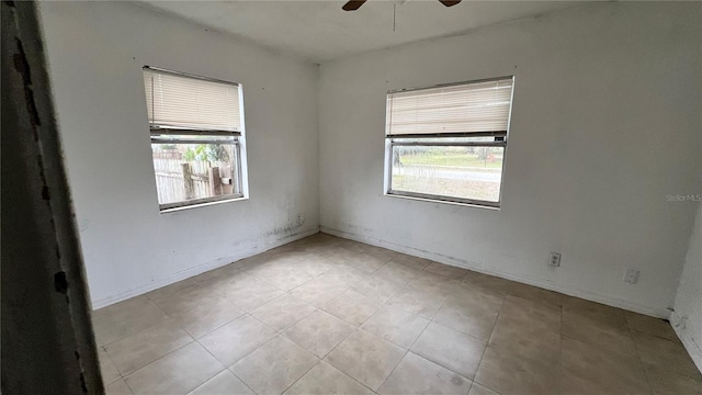 spare room featuring a ceiling fan