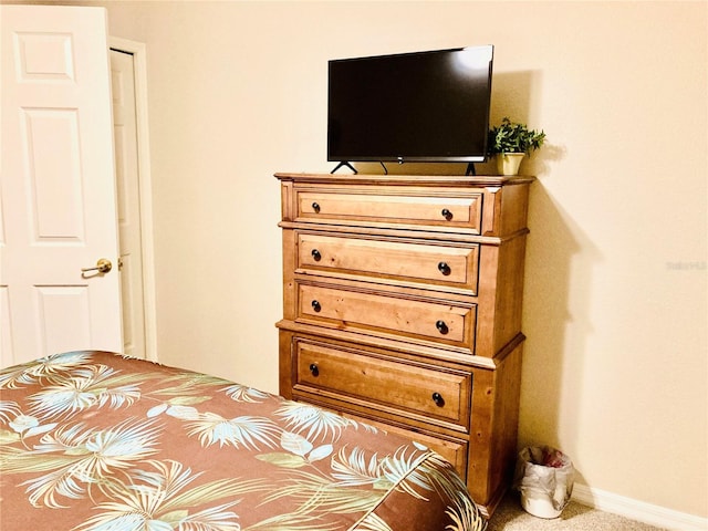 carpeted bedroom with baseboards