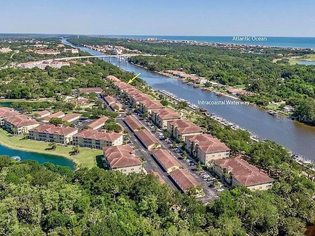 drone / aerial view with a water view