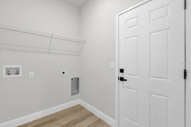 laundry area with light wood finished floors, washer hookup, baseboards, laundry area, and hookup for an electric dryer