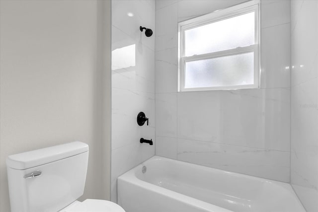 bathroom featuring toilet and bathtub / shower combination