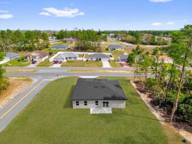 birds eye view of property with a residential view