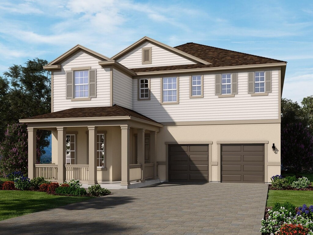 view of front of home featuring stucco siding, decorative driveway, a porch, a shingled roof, and a garage