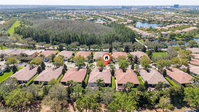 bird's eye view with a residential view and a water view