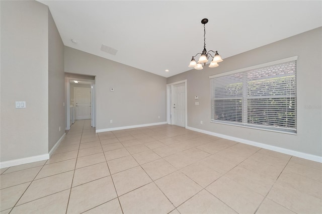 unfurnished room with baseboards, lofted ceiling, a chandelier, and light tile patterned flooring