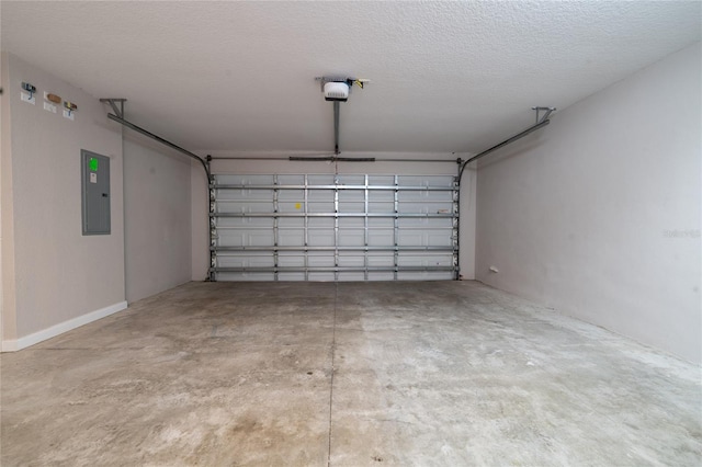 garage featuring electric panel and a garage door opener