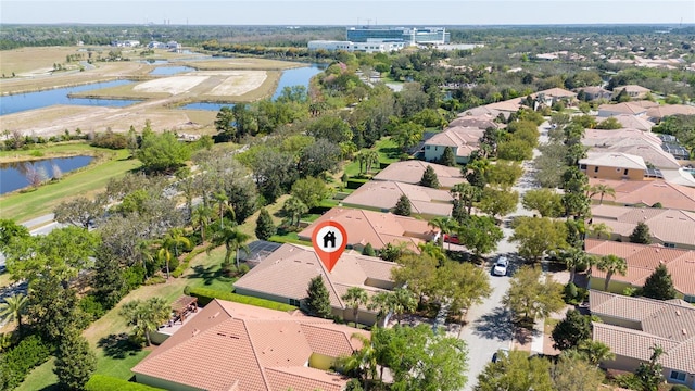 bird's eye view featuring a residential view and a water view