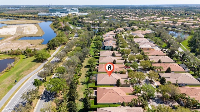 aerial view featuring a residential view and a water view