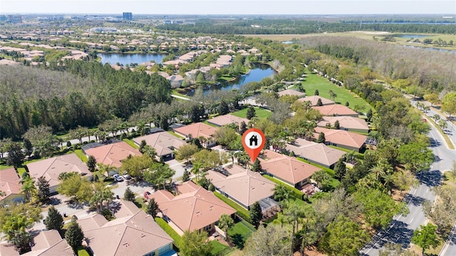 bird's eye view with a residential view and a water view