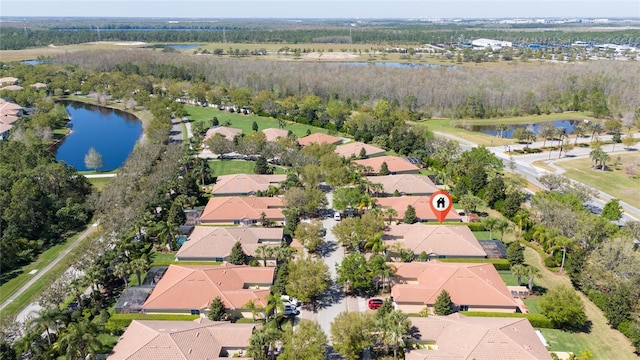 aerial view with a residential view and a water view