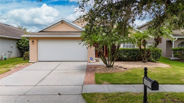 single story home featuring stucco siding, an attached garage, concrete driveway, and a front lawn