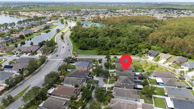 birds eye view of property featuring a water view and a residential view