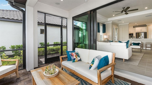 sunroom featuring ceiling fan