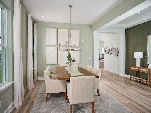 dining space with recessed lighting, light wood-style flooring, and baseboards