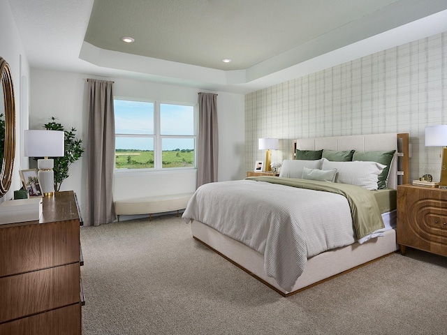 carpeted bedroom with recessed lighting, wallpapered walls, and a tray ceiling